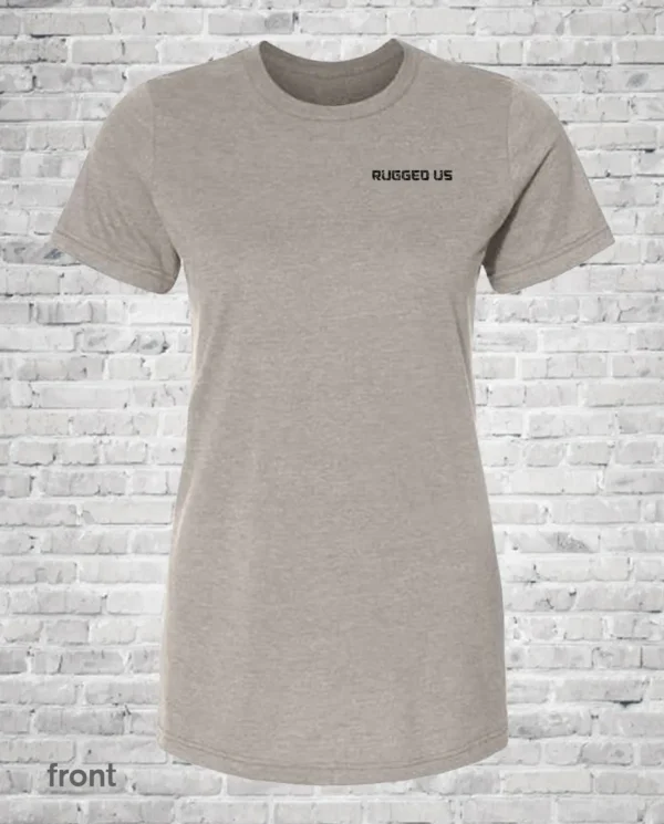 A women 's t-shirt with the words " business on " written in front of a brick wall.