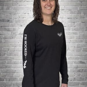 A woman wearing a black long sleeve shirt.