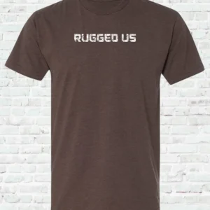 A brown shirt with the words rugged us written on it.