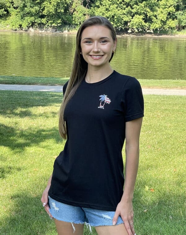 A woman standing in front of some water