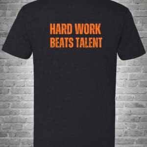 A black t-shirt with the words " hard work beats talent ".