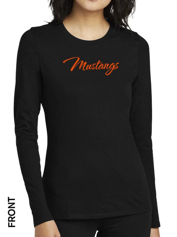 A woman wearing a black long sleeve shirt with the word mustangs on it.