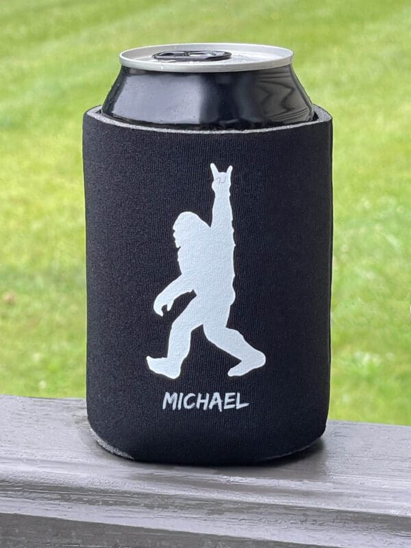 A can cooler with an image of a bigfoot.