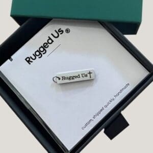 A box with a tag in it and the words rugged us